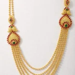Sha Jewellers Heritage 22k Gold Four-Strand Layered Chandan Haar with Ruby and Emerald Side Pendants | Traditional Indian Necklace with Mango and Peacock Motifs