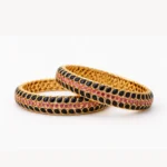Sha Jewellers 916 Studded 22k Gold Bangles Set of 2 featuring oval blue sapphires on both sides with central line of rubies