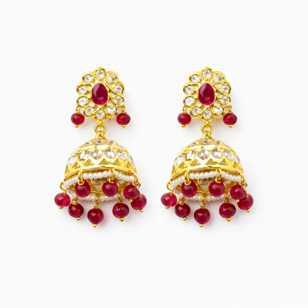 Sha Jewellers Floral Jhumka Earrings featuring teardrop ruby cabochon with CZ petal border, filigree bell with freshwater seed pearls, and cascading faceted ruby bead fringe