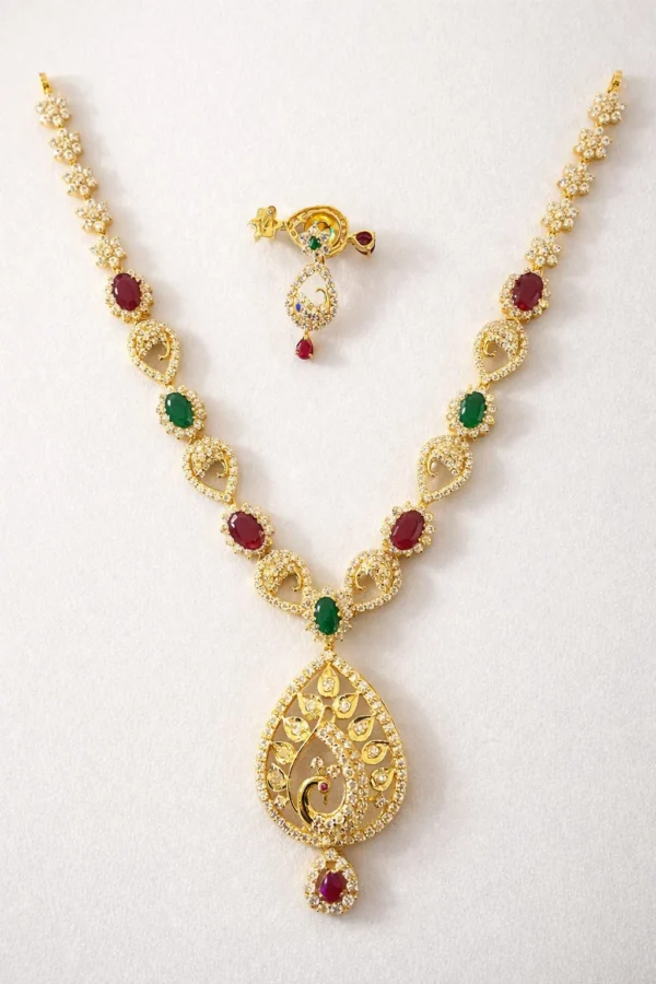 Sha Jewellers Peacock Motif Gemstone Haar and Earring Set featuring rubies, emeralds and white CZ stones in a teardrop pendant with matching drop earrings | Contemporary Temple-Style Jewelry