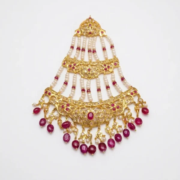 Sha Jewellers Ruby, Pearl and CZ Jhumar - Traditional Indian bridal side headpiece featuring cascading tiers of passionate red ruby stones, lustrous white South Sea pearls, and brilliant CZ accents in gold-tone setting