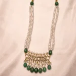 Sha Jewellers South Sea Pearl and Emerald Drop Necklace Set with matching earrings featuring two-strand pearl necklace, ornate pendant with ruby red stones and CZ, pearl and emerald fringe, and traditional sarafa adjustable cord
