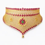 Shah Jewellers 22k Gold Heritage Choker featuring antique gold chevron pattern, emerald floral centerpiece, and intricate honeycomb filigree work