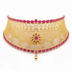 Shah Jewellers 22k Gold Grand Ruby Choker featuring radiant sunburst motif with ruby-pink stones and intricate traditional Jali work