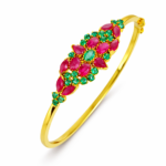 Shah Jewellers 22k Gold Bracelet featuring large rubies surrounded by emerald halos in repeating pattern design