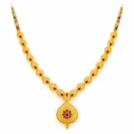 Shah Jewellers 22k Gold Ruby and Emerald Stone-Studded Indian Heritage Necklace featuring vibrant rubies and lush emeralds in traditional design